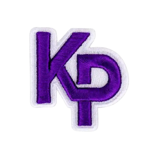 A close-up of custom purple interlocking KP letters demonstrating sharp, high-density 3D puff embroidery digitizing.